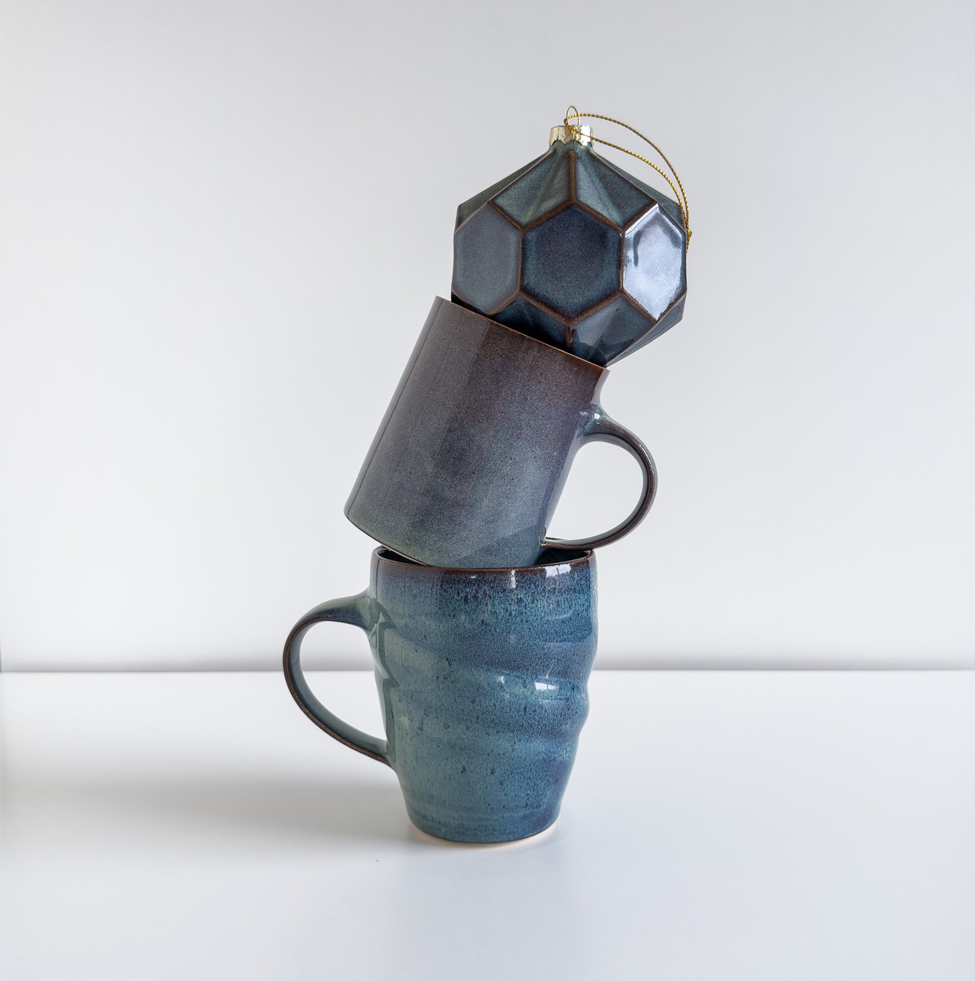 Several mugs stacked one on top of the other.